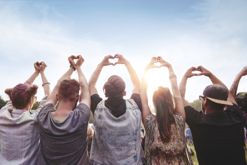 group of people showing the heart shape